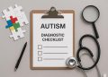 Pediatrician assessing child for early signs and symptoms of autism spectrum disorder