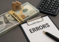 Mortgage paperwork and calculator highlighting key steps to prevent mortgage errors