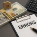 Mortgage paperwork and calculator highlighting key steps to prevent mortgage errors